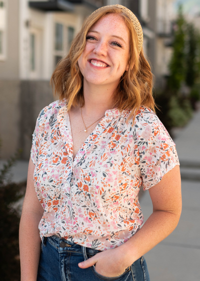 Ivory floral top with buttons at the neck