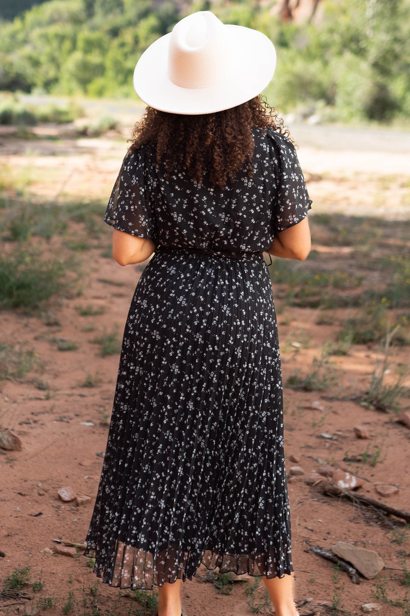 Back view of a black floral dress