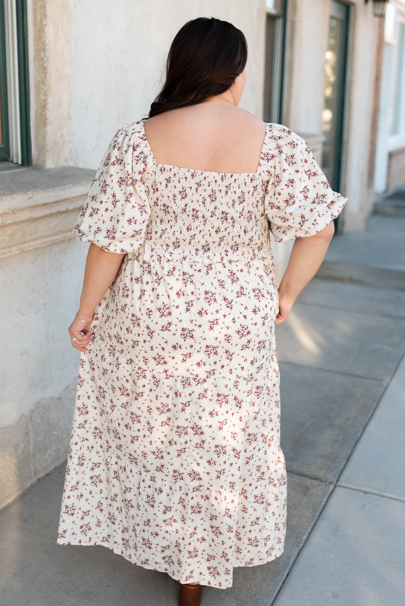 Back view of the beige floral smocked dress in plus size