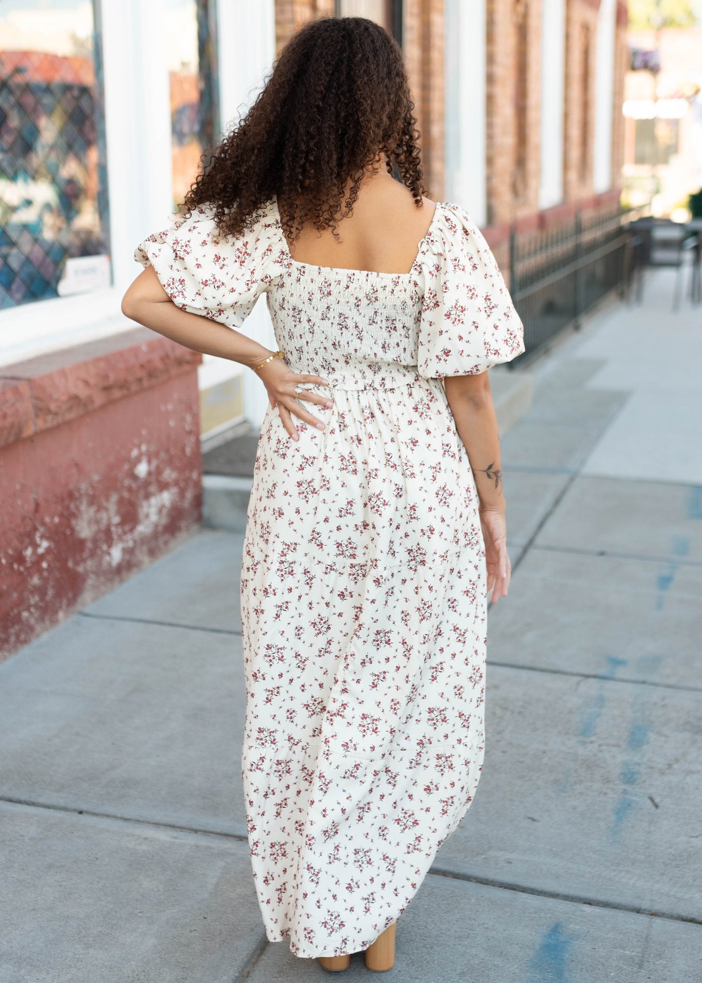 Back view of the beige floral smocked dress