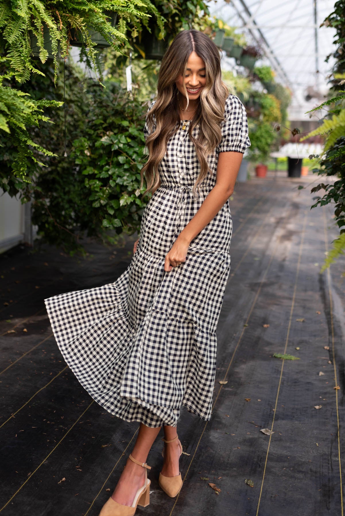 Short sleeve navy tiered dress with a button up bodice