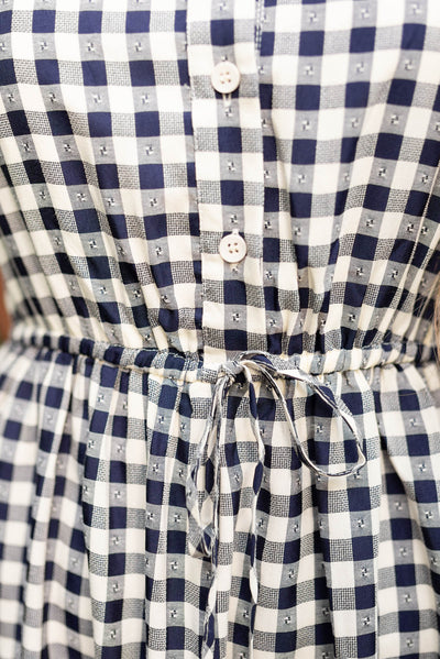 Close up of the waist on the navy tiered dress