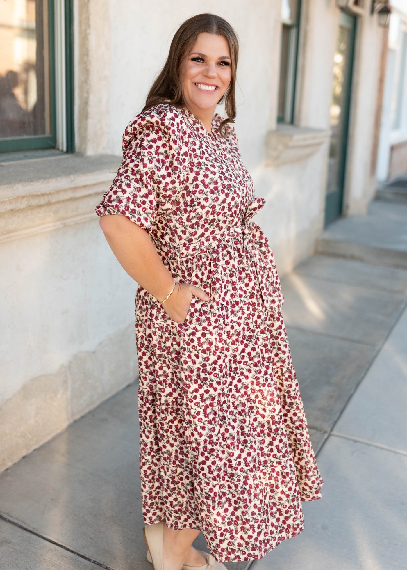 Side view of the burundy floral dress in plus size with pockets