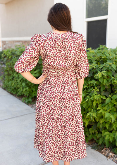 Back view of the burgundy floral dress with an ivory background