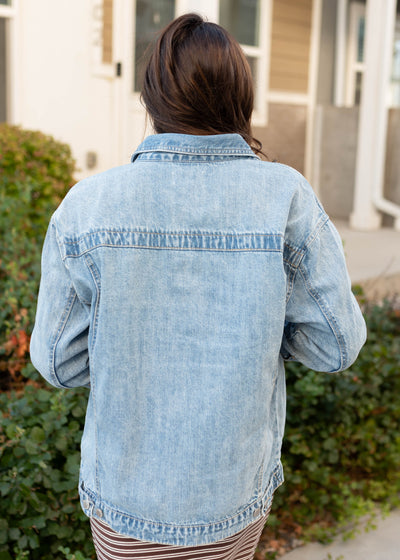 Back view of the light denim oversized jacket