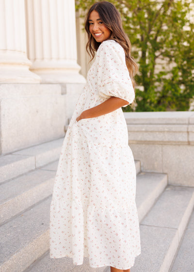 Side view of the the ivory floral dress with a high waist
