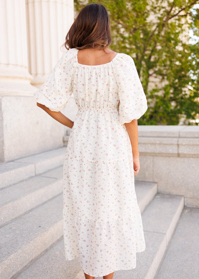 Back view of the ivory floral dress with pockets