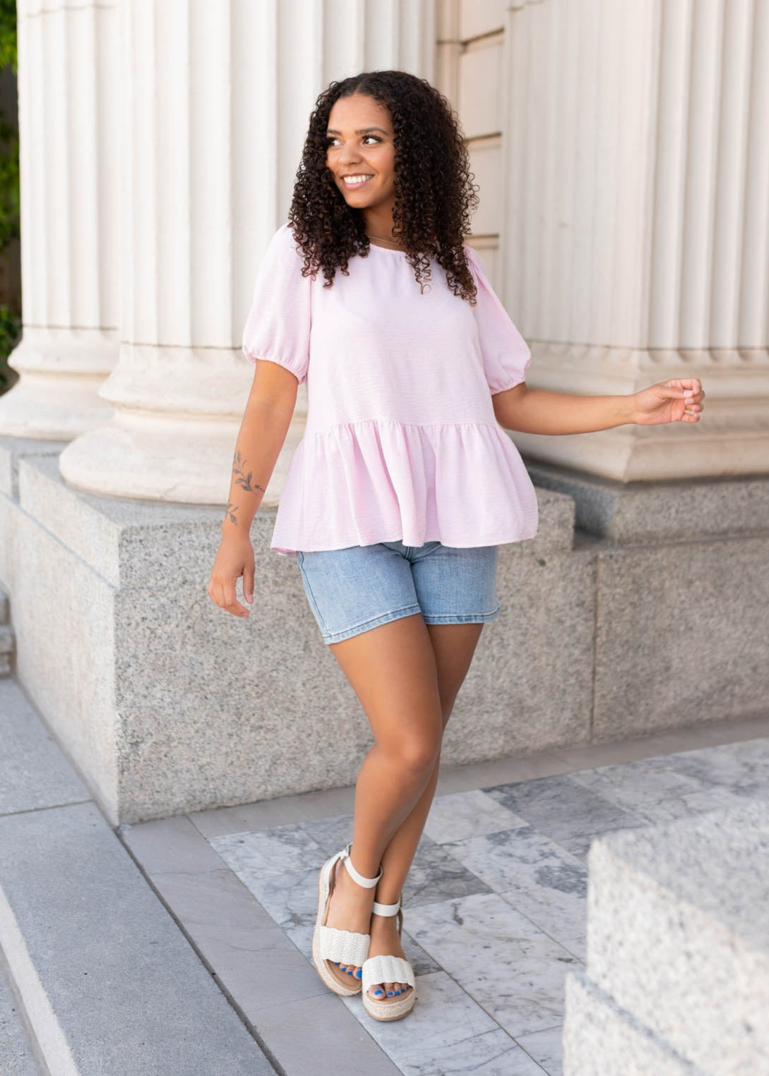 Pink peplum top in size small