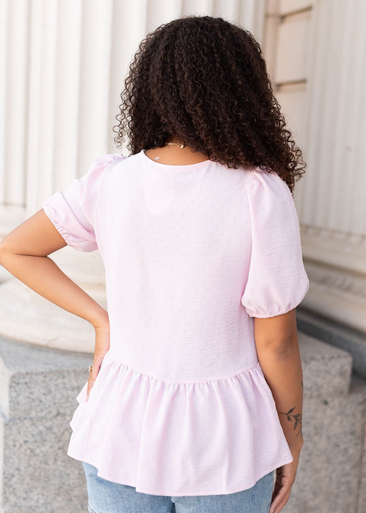 Back view of the pink peplum top