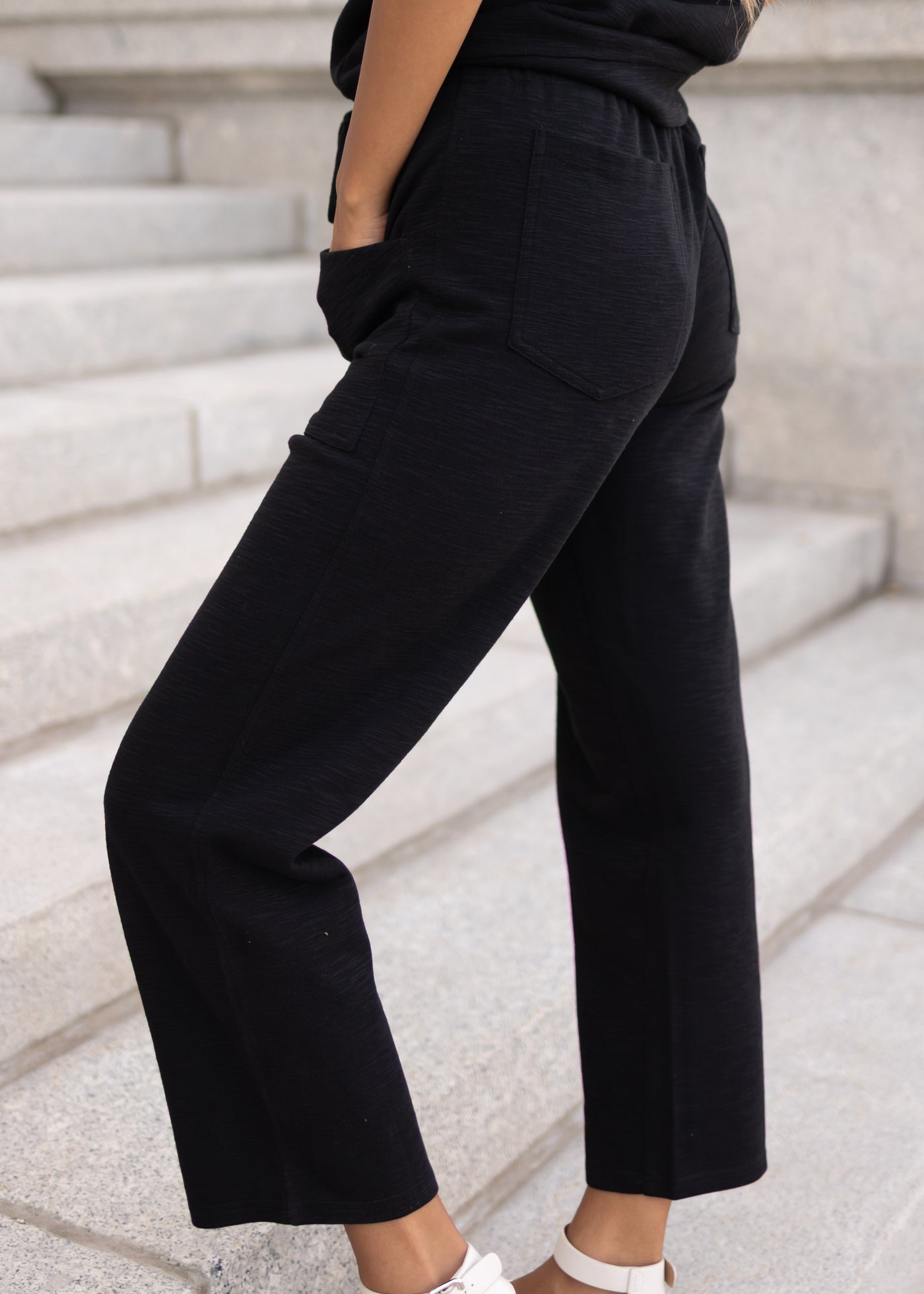 Side view of the black knit pants at Lena Layne