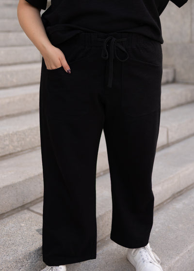 Plus size black knit pants with front pockets