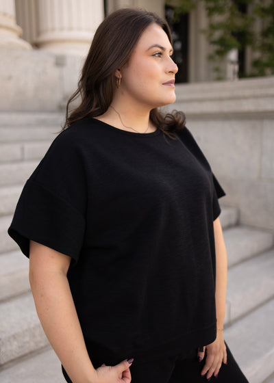 Drop sleeve on the plus size black knit top