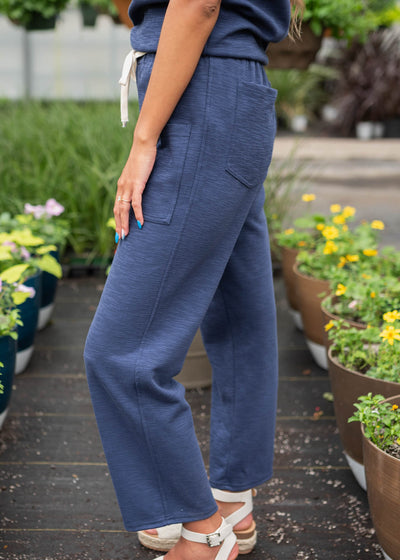 Side view of the navy knit pants