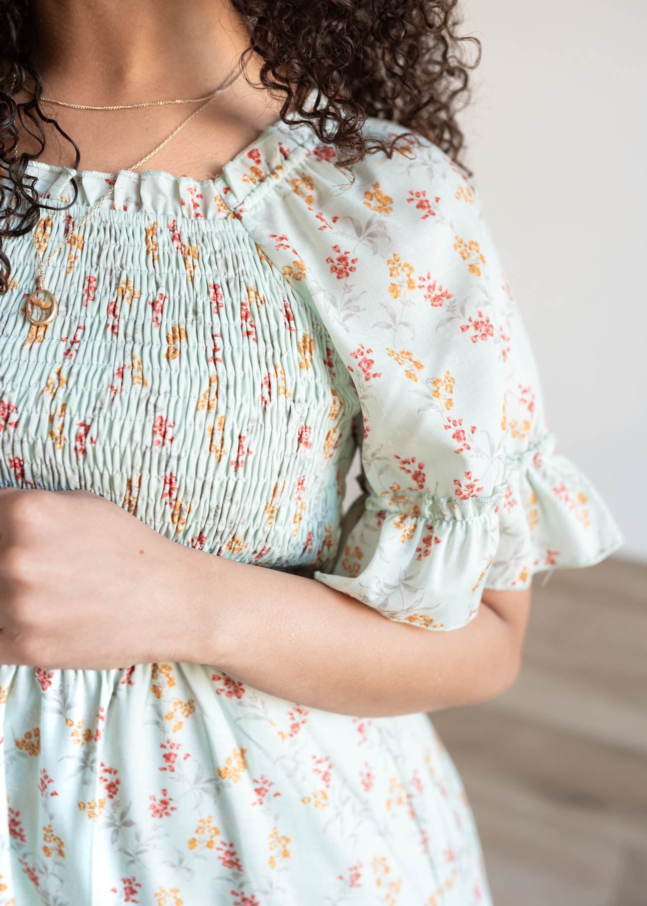 Close up of the sleeve and fabric on the mint floral dress