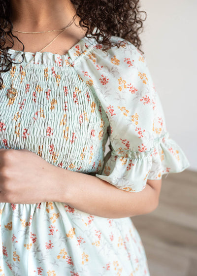 Close up of the sleeve and fabric on the mint floral dress