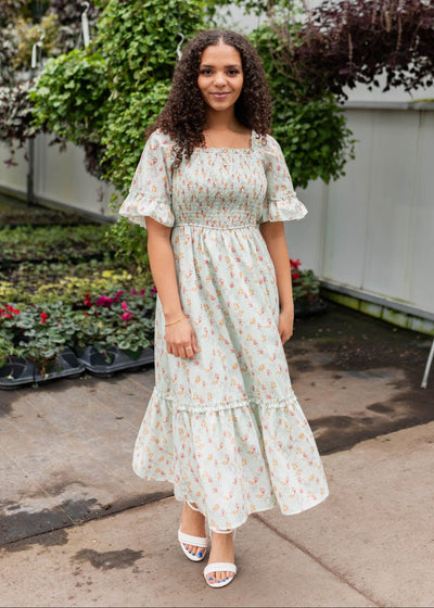 Mint floral dress with short sleeves and a ruffle on the cuff