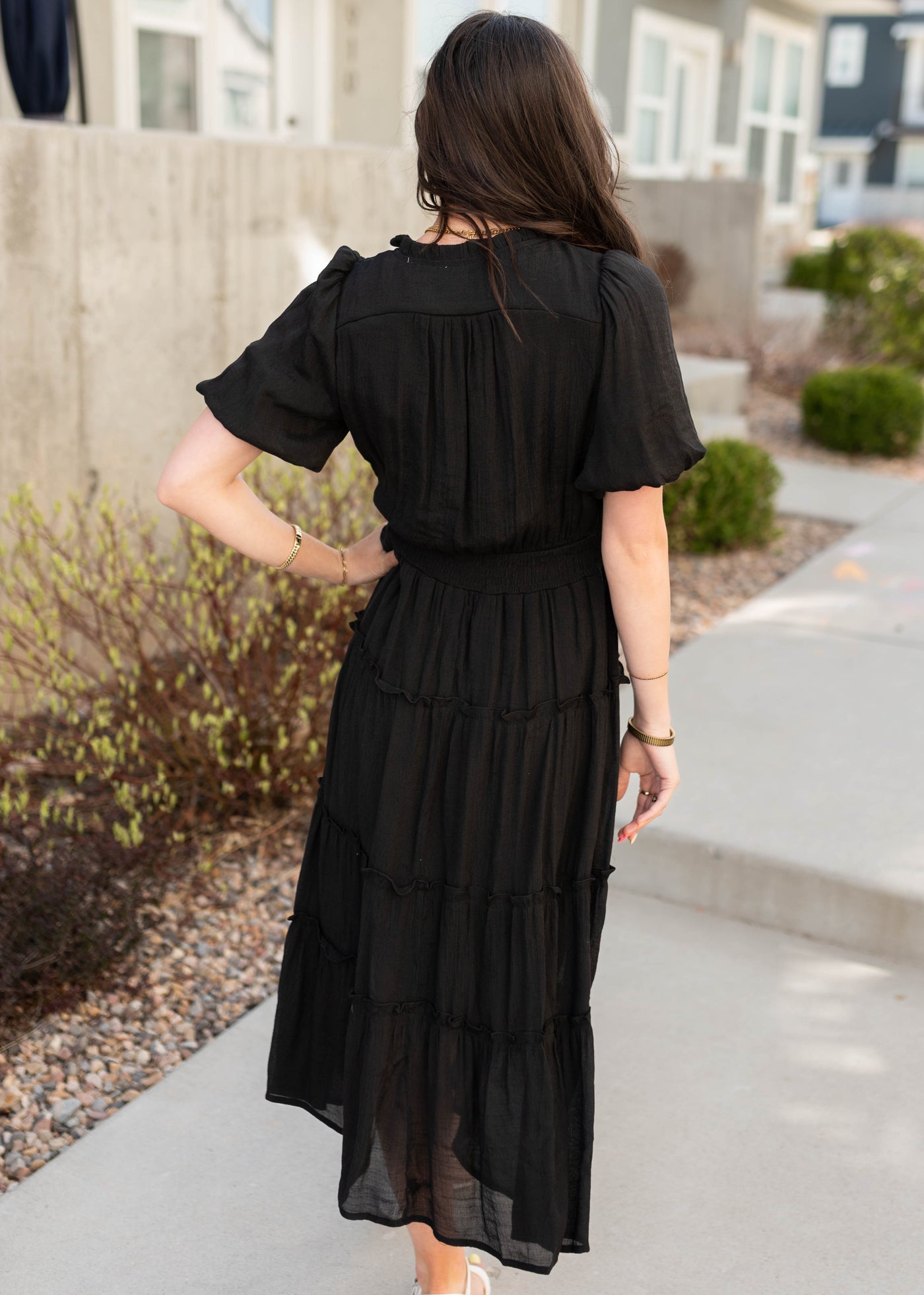 Back view of the black puff sleeve dress