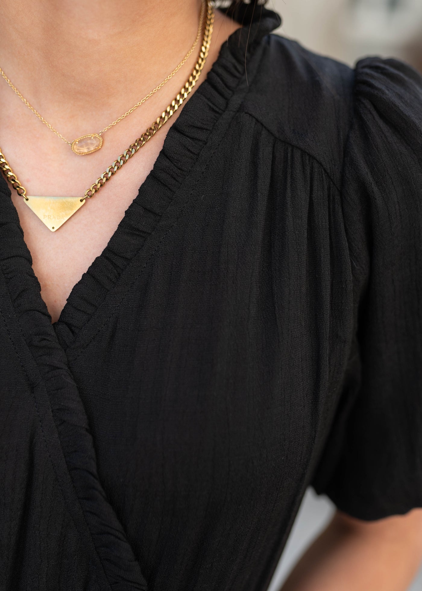 Close up of the bodice on the black puff sleeve dress