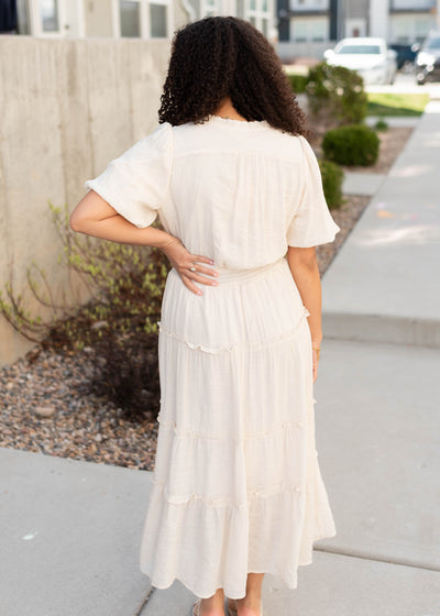Back view of the natural puffed sleeve dress