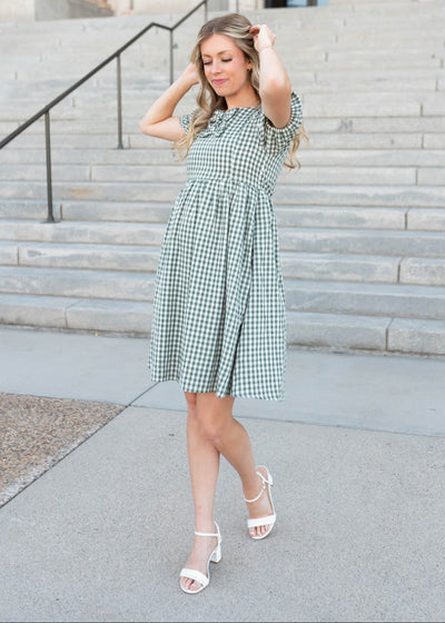 Small sage gingham bow dress that fall right above the knee.