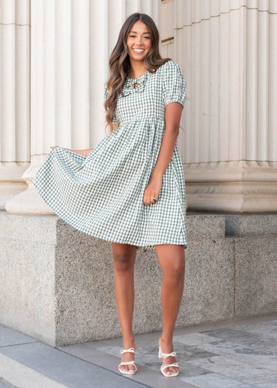 Modest short sleeve sage gingham bow dress with bows at the neck and pockets