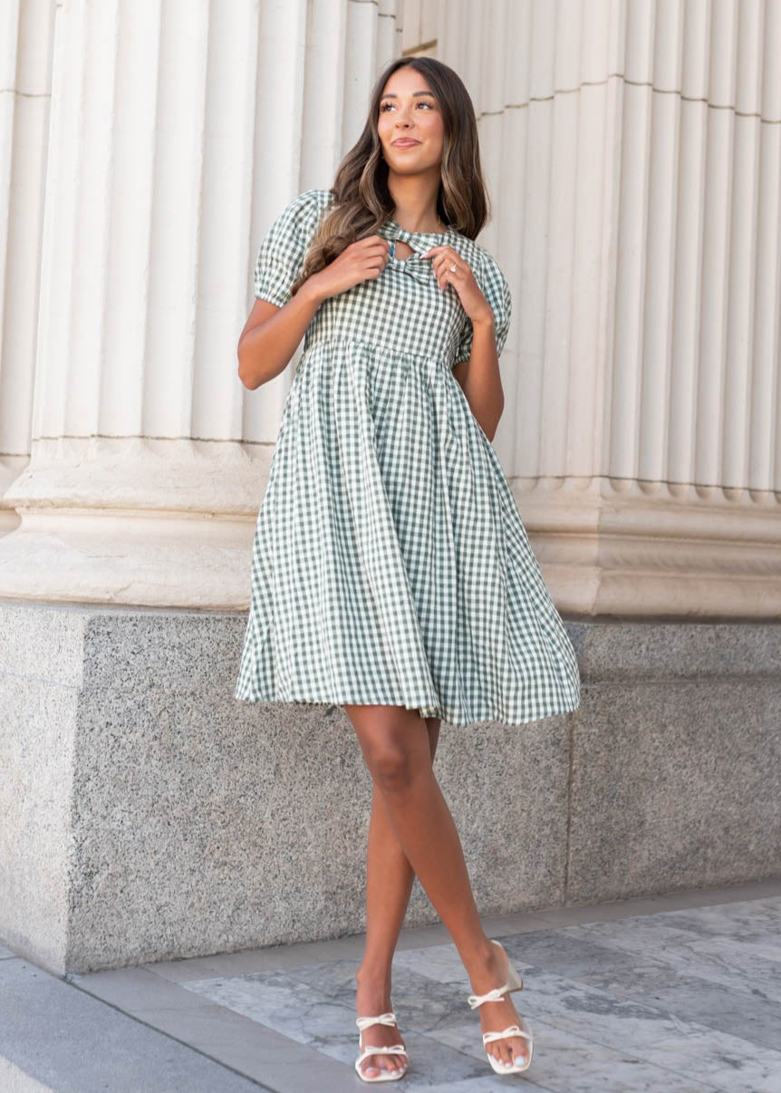 Above the knee sage gingham bow dress with bows at the neckline