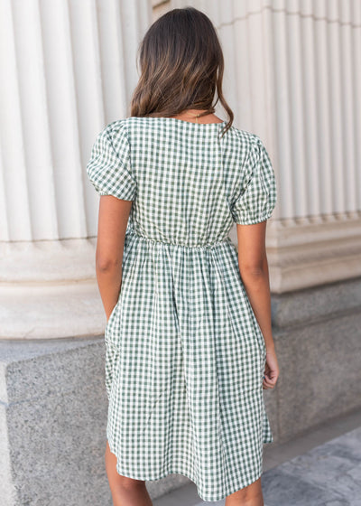 Back view of the sage gingham bow dress