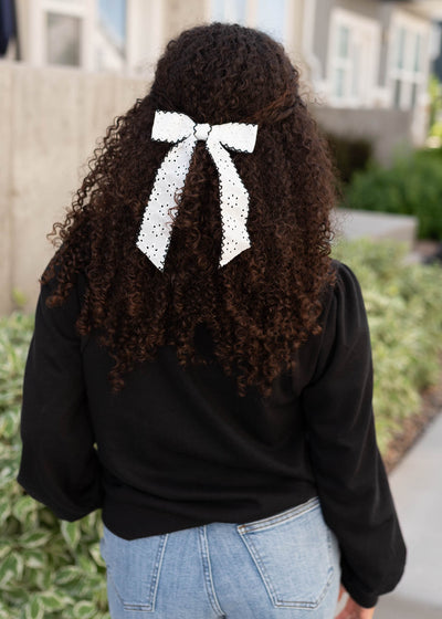 Back view of the black long sleeve top