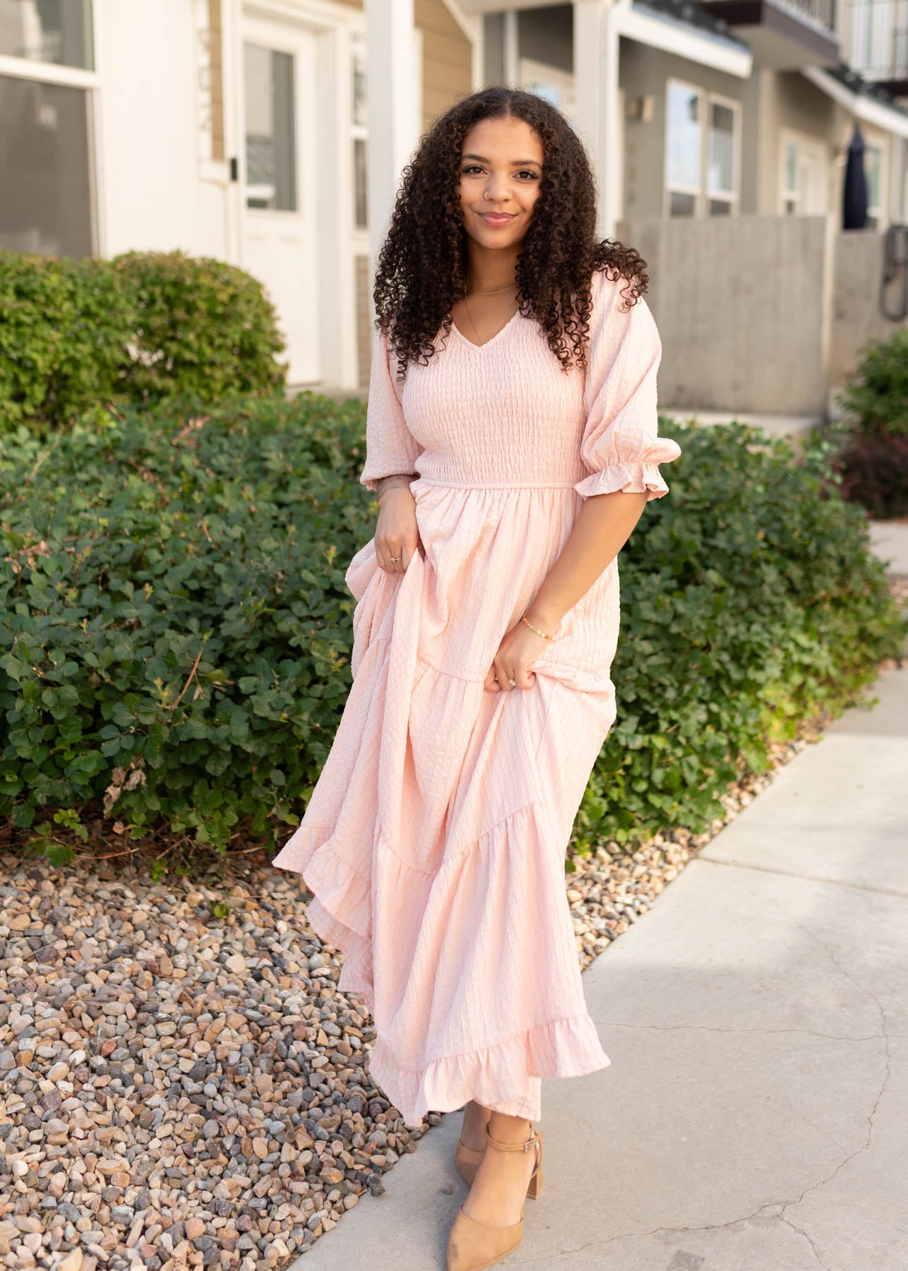 Tiered skirt on the modest blush smocked dress