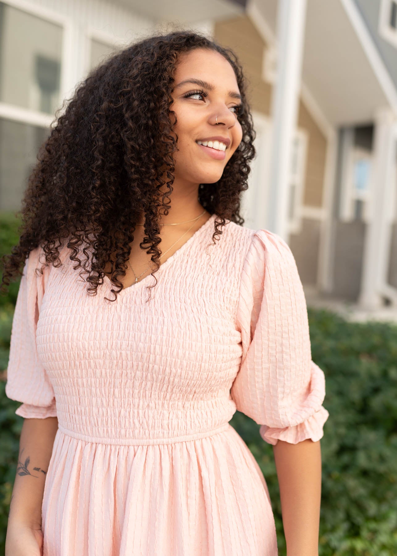 Close up of the smockeing on the modest blush smocked dress