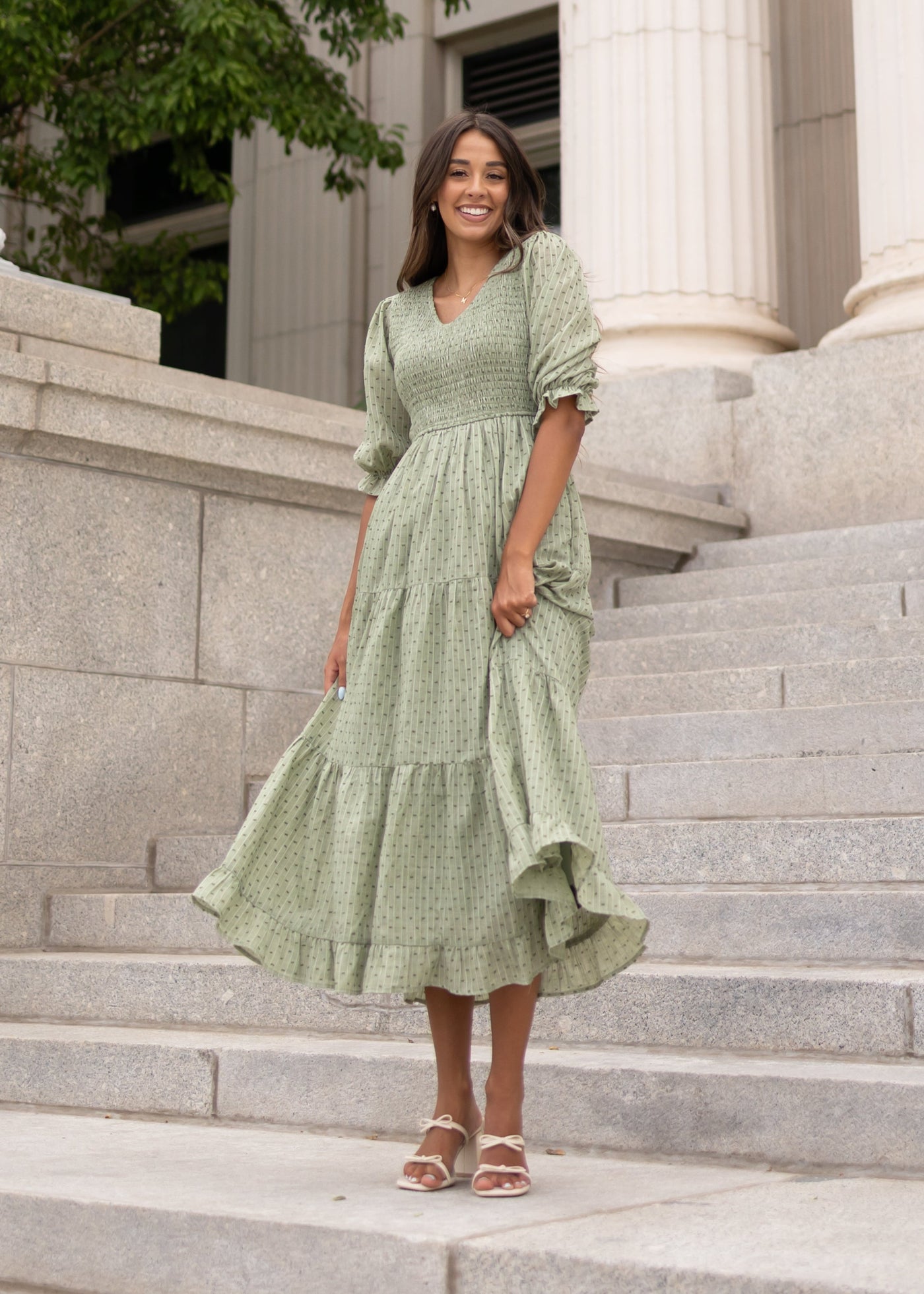 Modest green smocked dress with short sleeves sold at Lena Layne