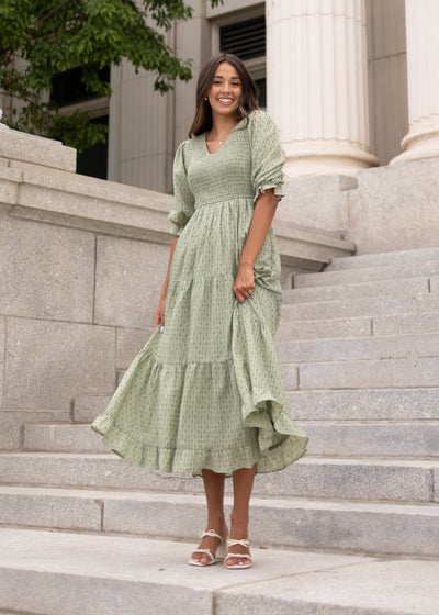 Modest green smocked dress with short sleeves sold at Lena Layne