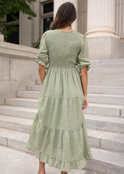Back view of the modest green smocked dress