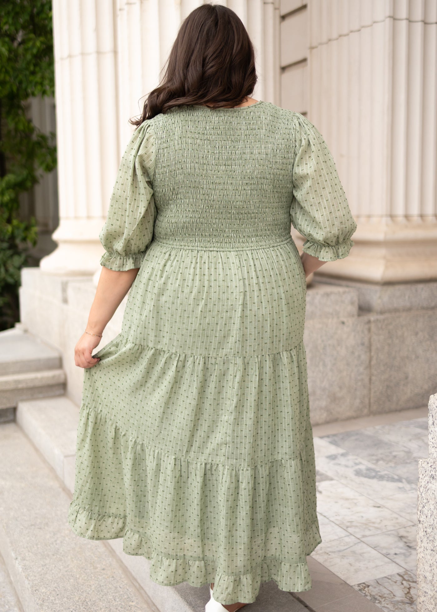 Back view of the plus size green smocked dress