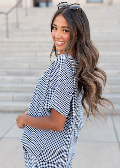 Side view of the black gingham top