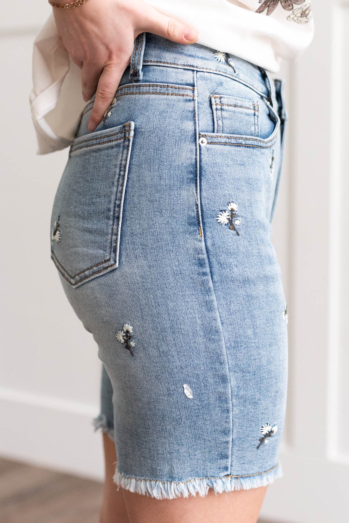 Side view of the floral embroidered shorts