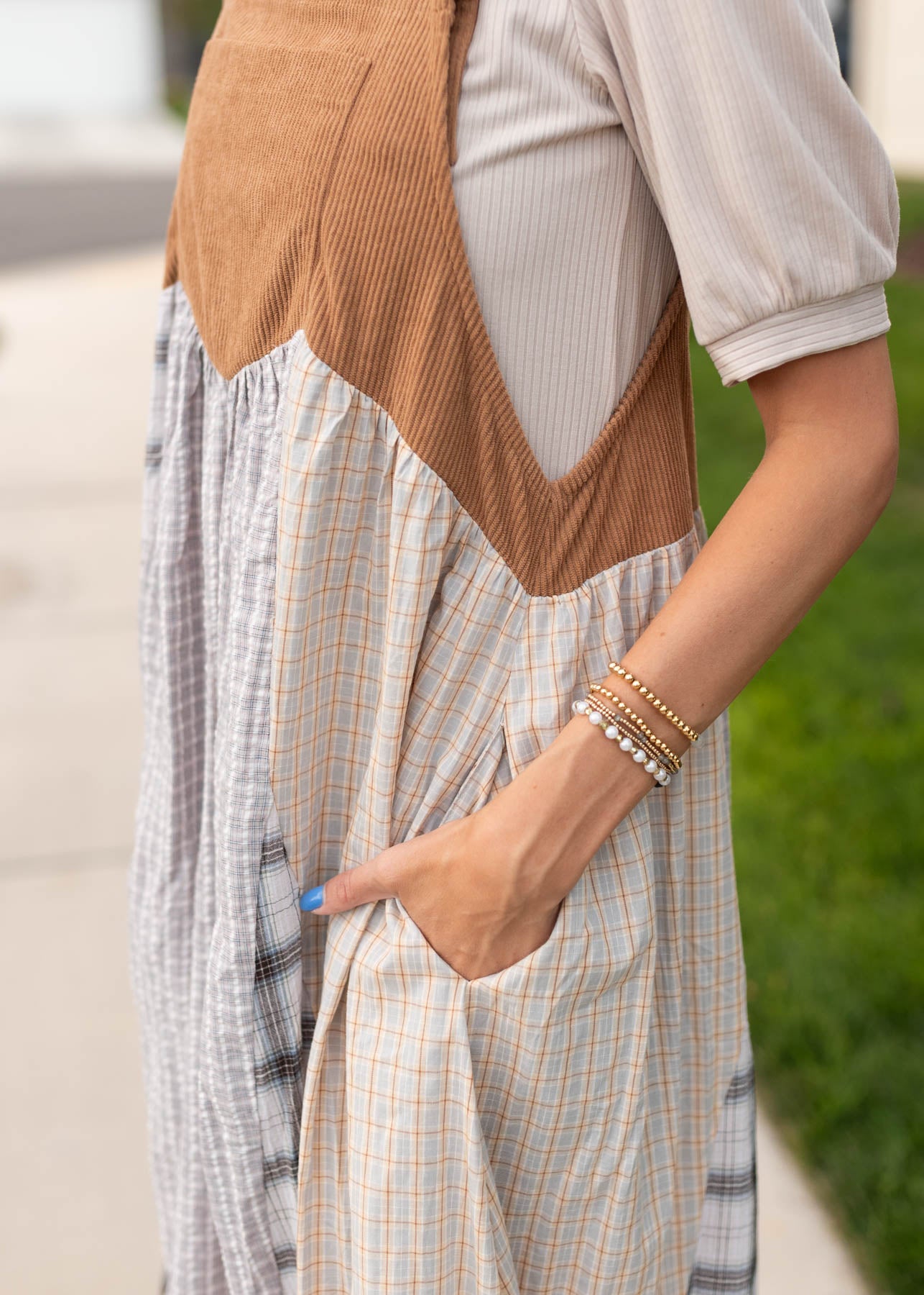 Close up of the fabric pattern on the modest patchwork overall dress