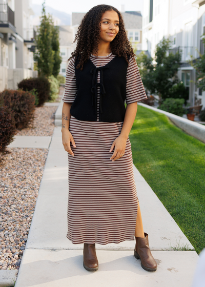 Slits in the sides of the modest chestnut stripe dress