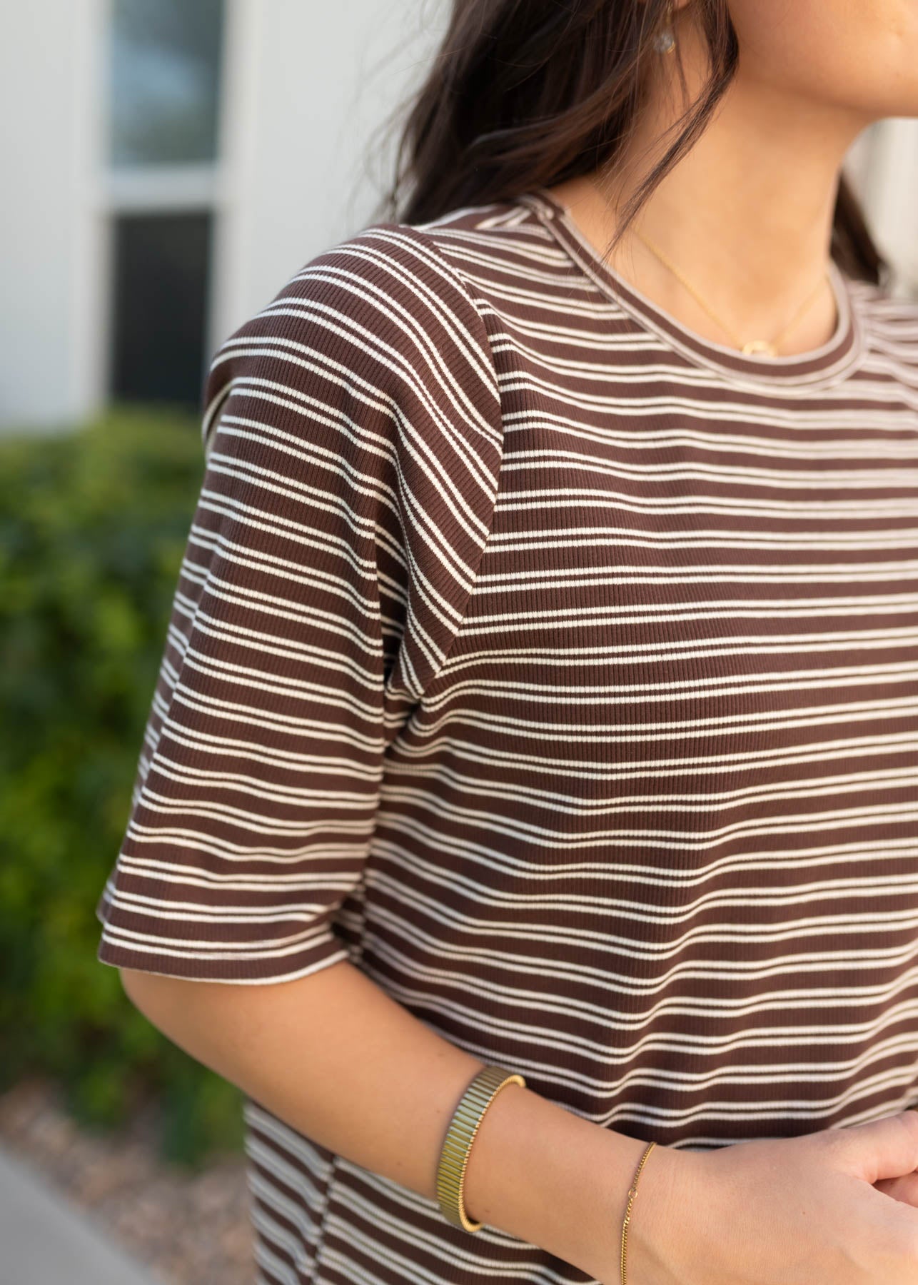 Close up of the fabric and sleeve on the chestnut stripe dress