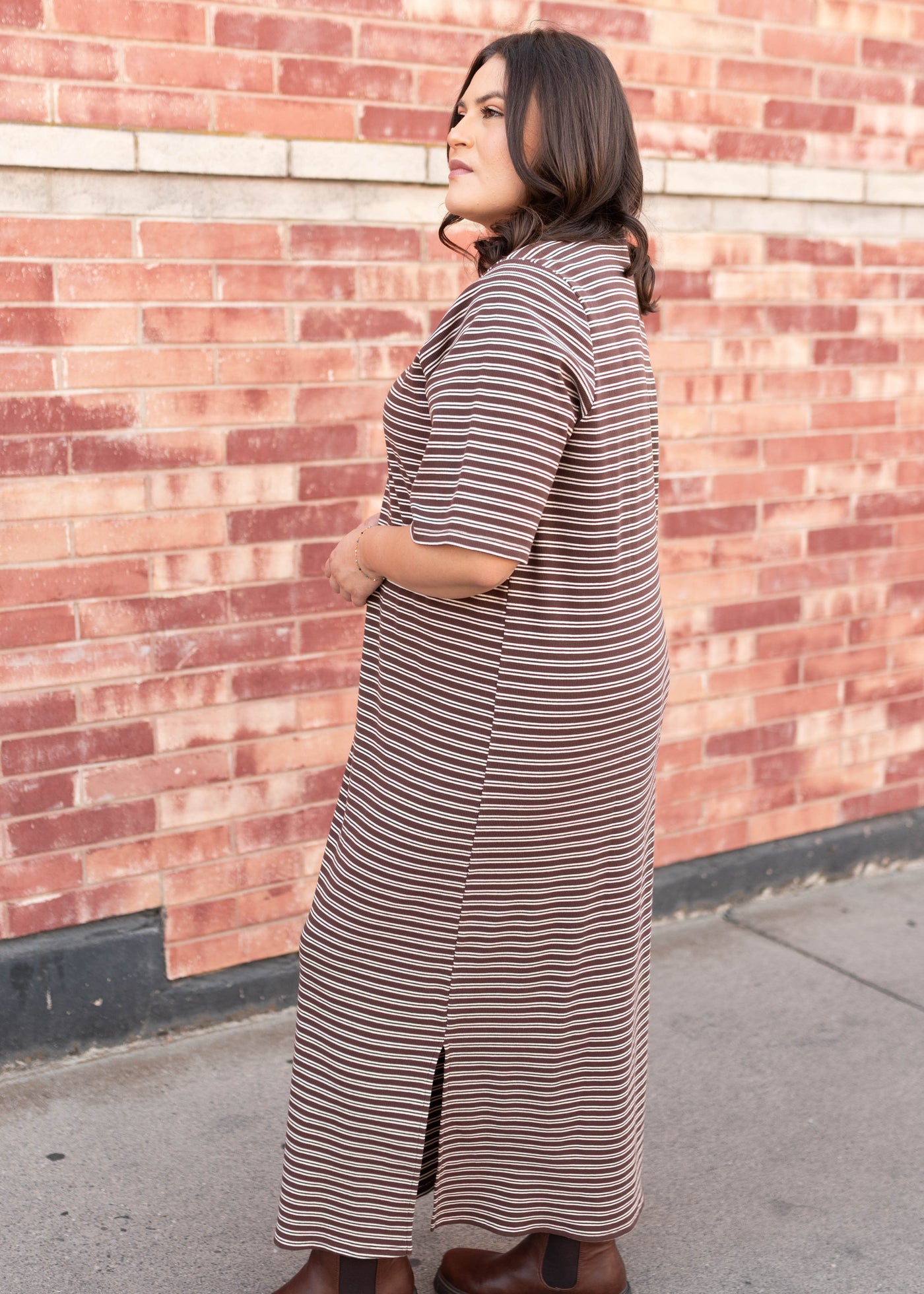 Side view of the plus size chestnut stripe dress