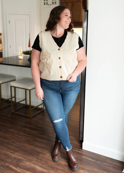 Flower patch sweater vest in plus size that buttons up