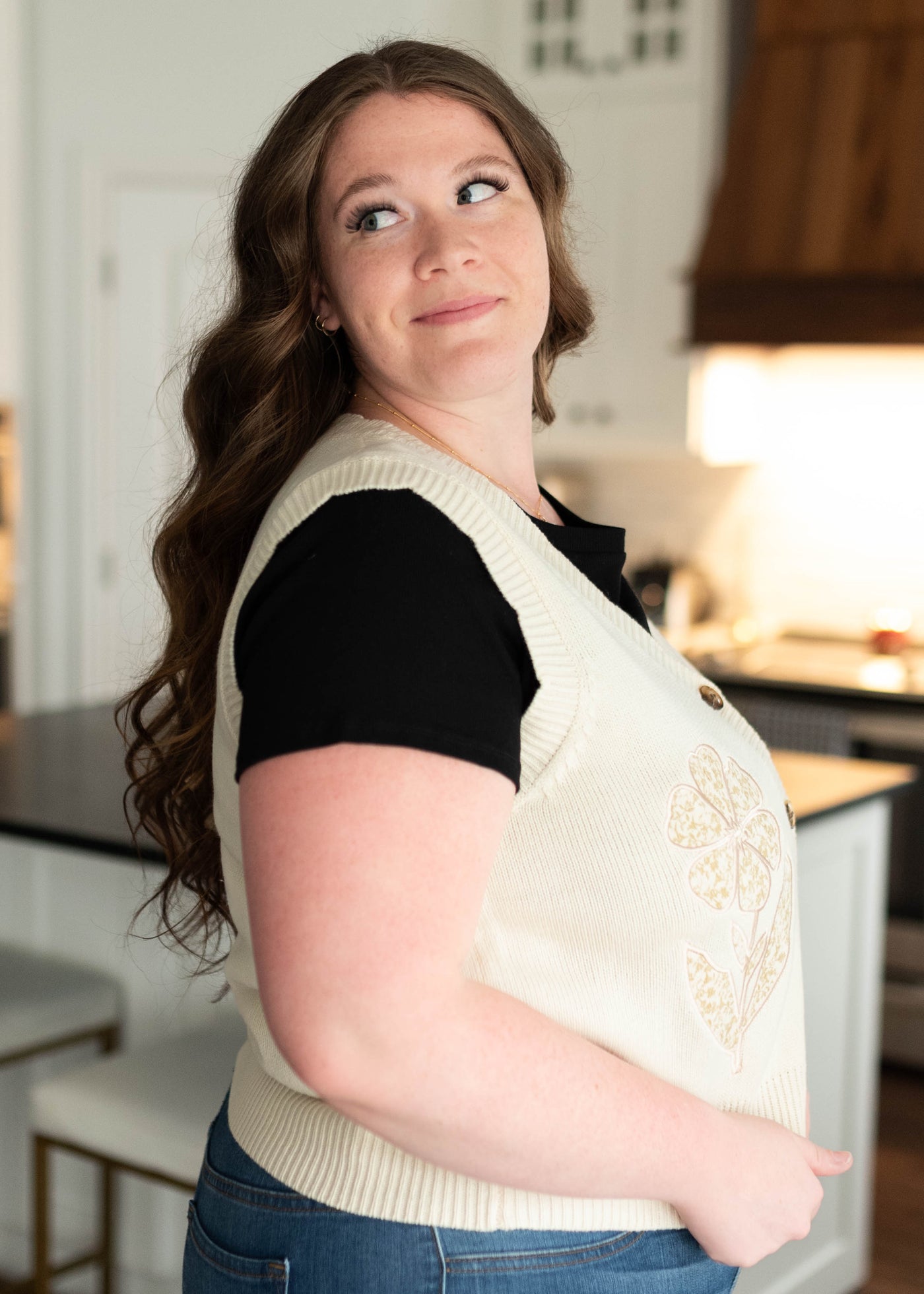 Side view of the plus size flower patch sweater vest