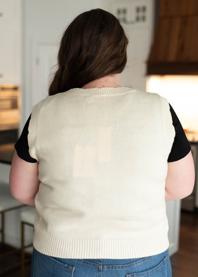 Back view of the plus size flower patch sweater vest
