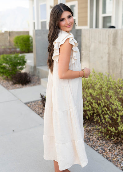 Side view of the natural flutter sleeve dress