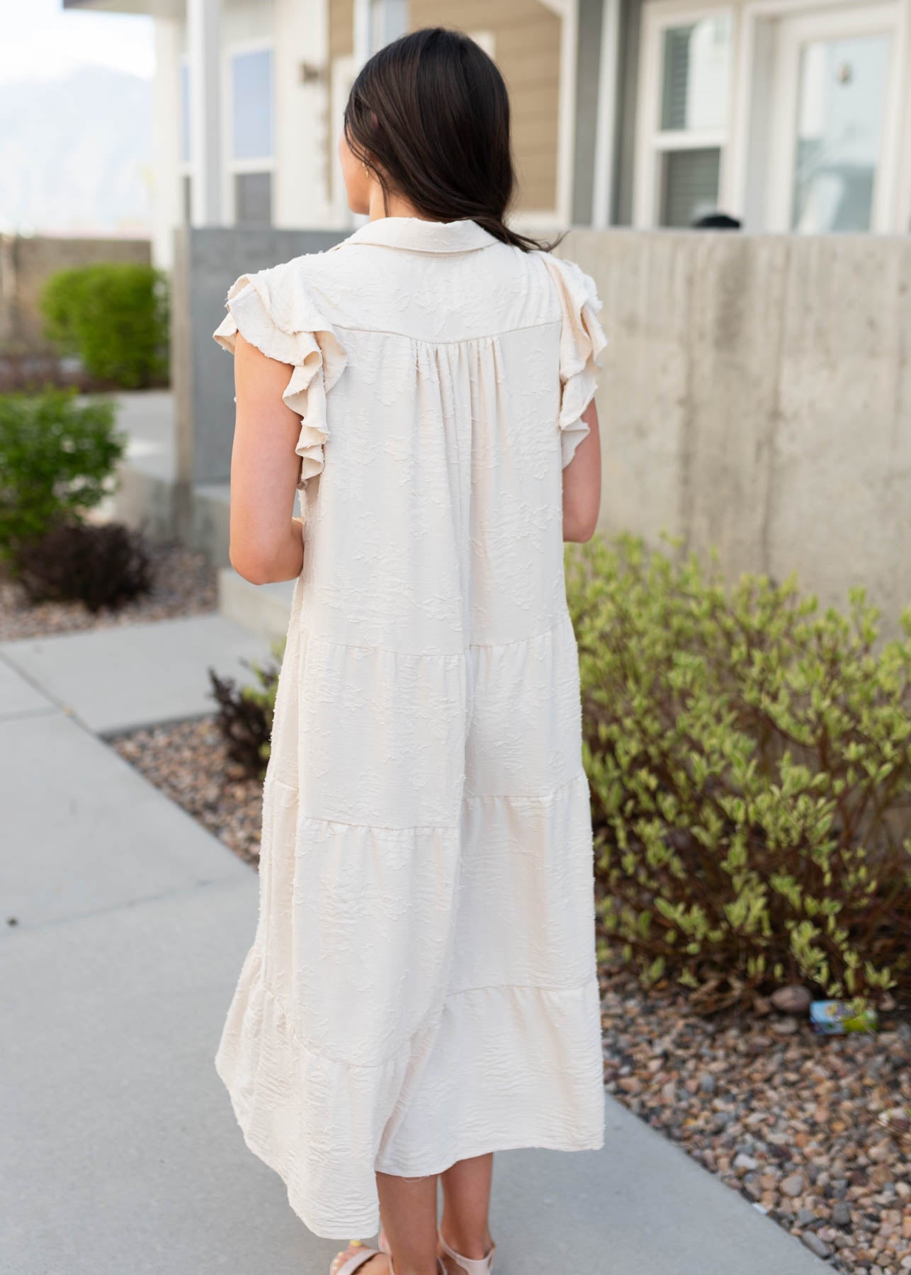 Back view of the natural flutter sleeve dress