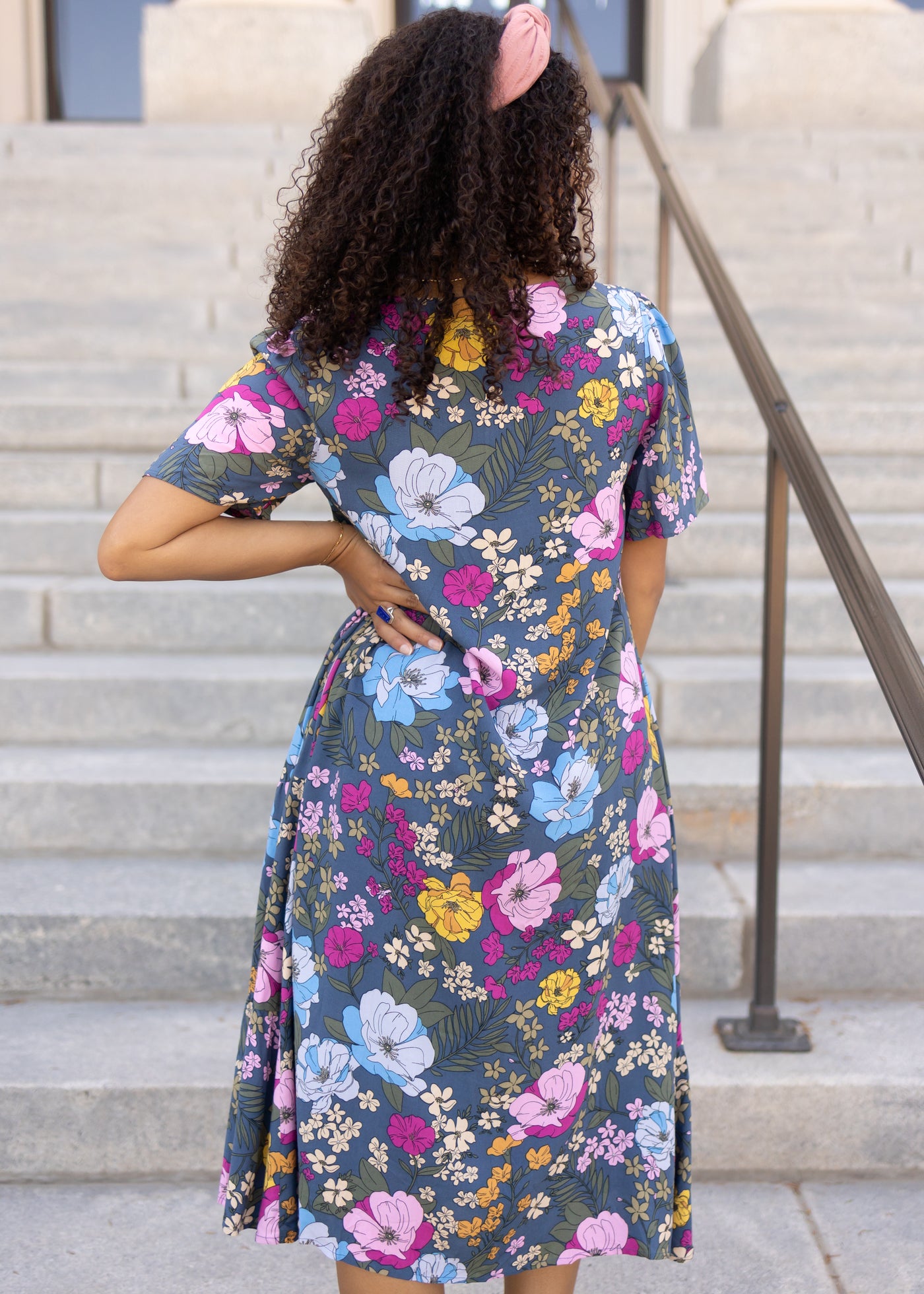 Back view of a blue floral dress