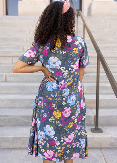 Back view of a blue floral dress