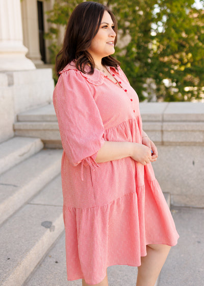 Side view of the red gingham dress in plus size with tiered skirt