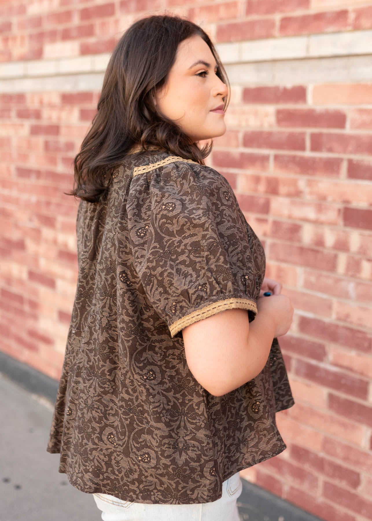 Side view of the plus size brown pattern top
