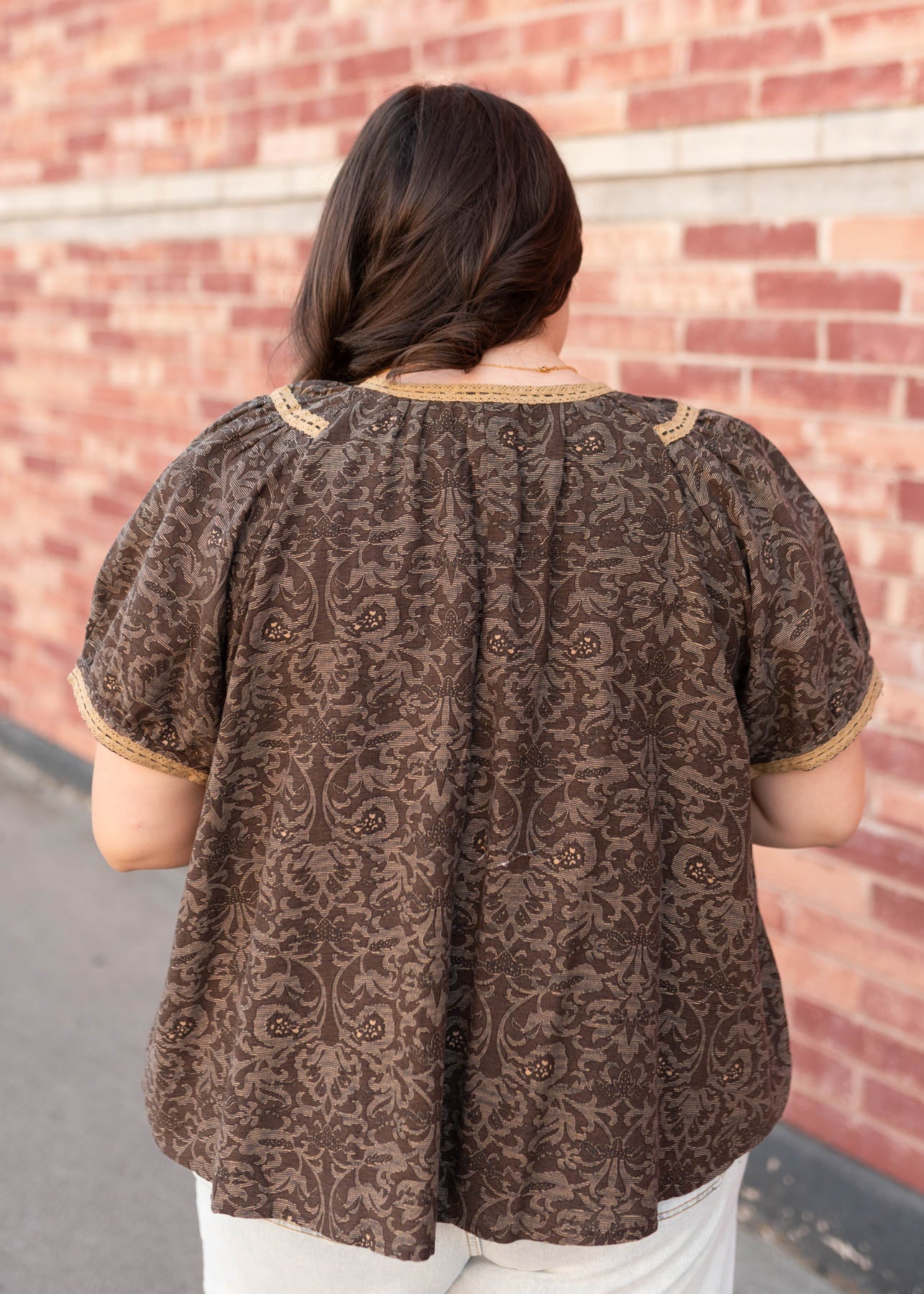Back view of the plus size brown pattern top